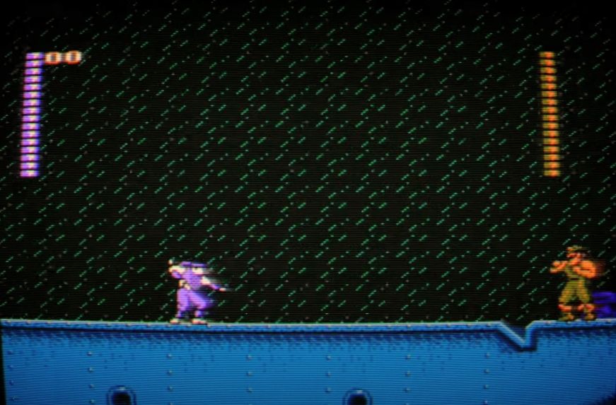 Captura-de-pantalla_20-5-2025_71521_www.youtube.com-fotor-2025052071639 Blue Shadow (NES, 1991): La danza olvidada de la sombra y el acero