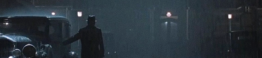 Captura-de-pantalla_6-2-2026_19410_www.youtube.com-fotor-20260206194531 Análisis de fotograma: La liturgia de la sombra bajo la lluvia en 'Camino a la perdición'