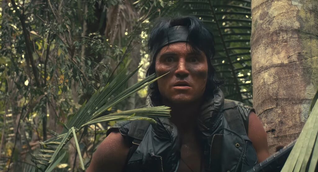 Captura-de-pantalla_3-3-2026_202656_www.youtube.com_-1024x554 La jungla como delirio balístico: cuando John McTiernan convirtió el músculo en vacío