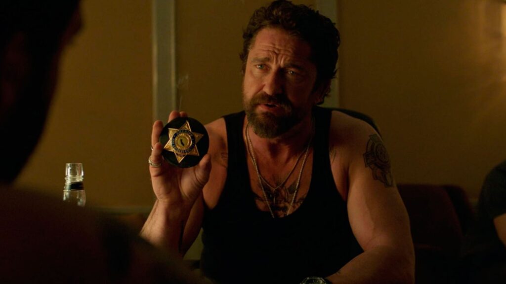 01769689900037-1024x576 Entre el acero y la sombra: la dignidad crepuscular de la saga Den of Thieves (Juego de ladrones)